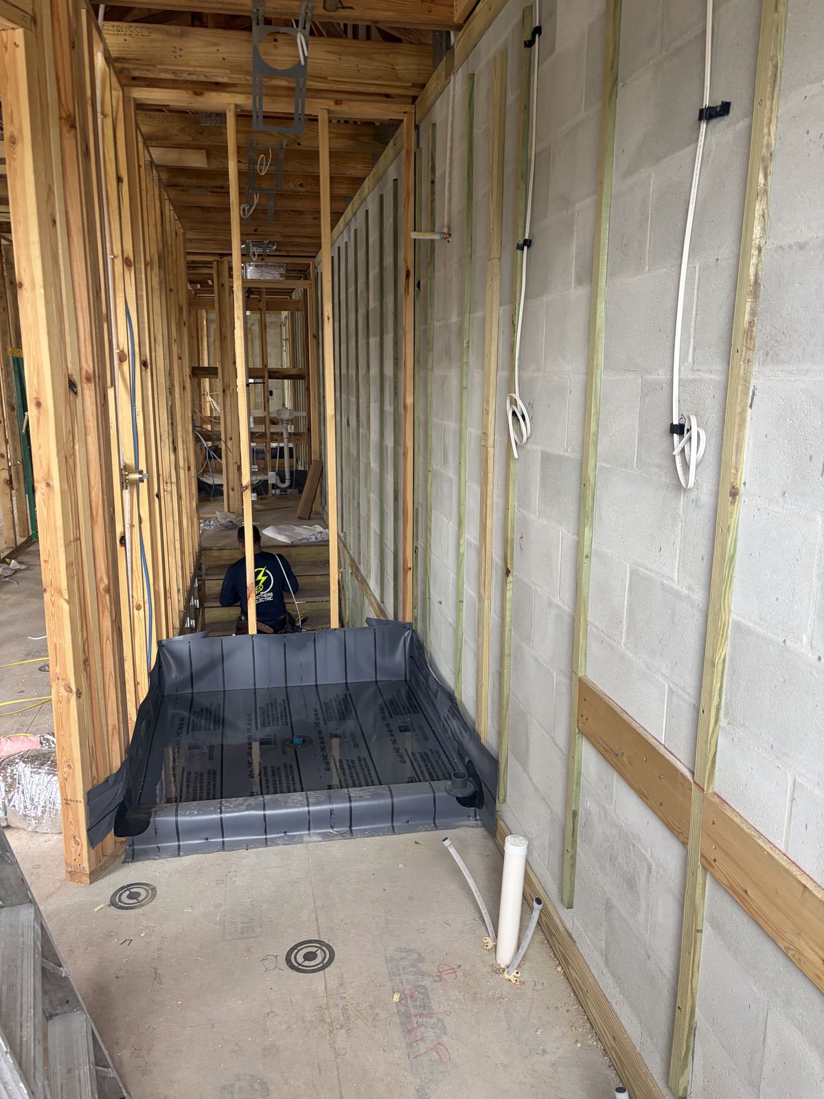 Construction progress: Shower base rough-in