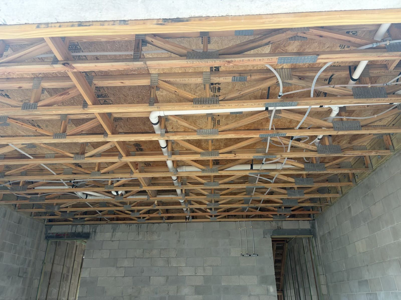 Construction progress: Plumbing lines in the ceiling framing
