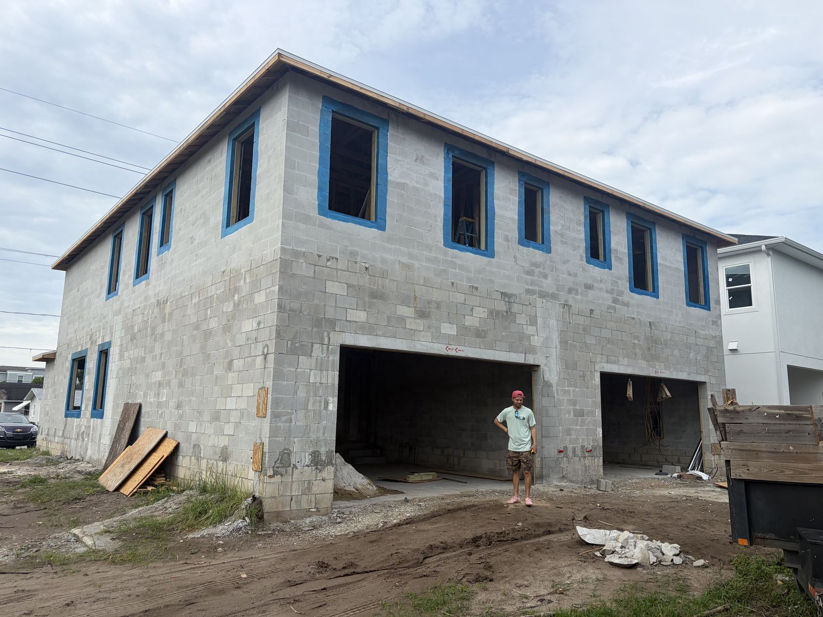Construction progress: Exterior: block walls, windows, and two-car garages in place
